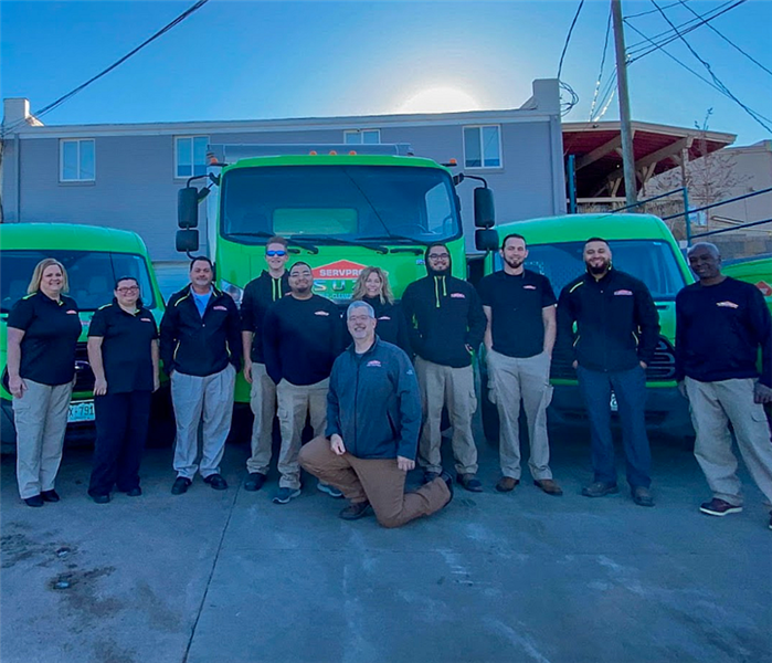 group of SERVPRO team members in front of a SERVPRO truck